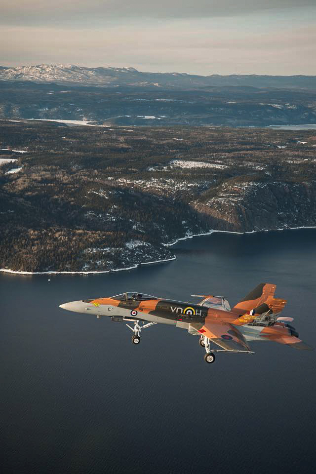 Battle of Britain - RAF/RCAF 75th Anniversary Schemes 18 The 2015 CF-18 Hornet Demonstration Aircraft flies over the Saguenay River on April 1st, 2015 near 3 Wing Bagotville, Saguenay, Qué. (Image: Canadian Armed Forces - LS Alex Roy, Atelier d'imagerie Bagotville.)