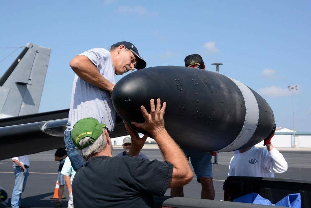138th Aviation Company Memorial - July, 2016 Update 14 Mounting the port wingtip radome. (Photo by Craig Landfield)