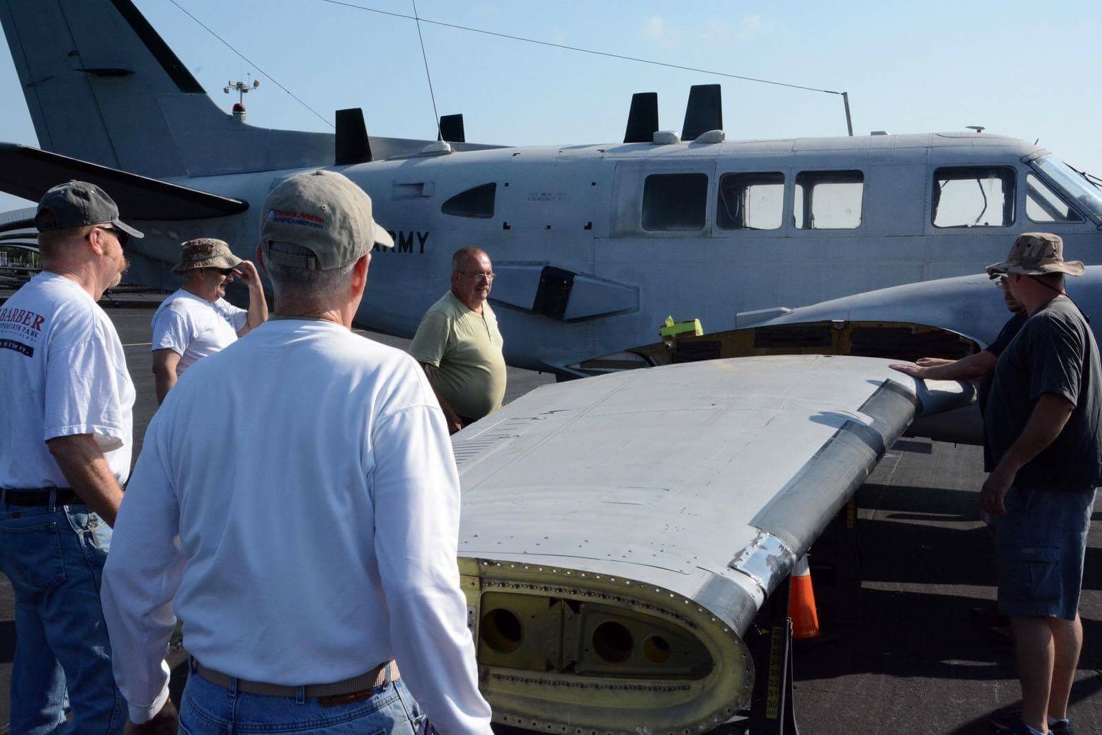 138th Aviation Company Memorial - July, 2016 Update 11 The starboard outer wing panel going on. (Photo by Craig Landfield)