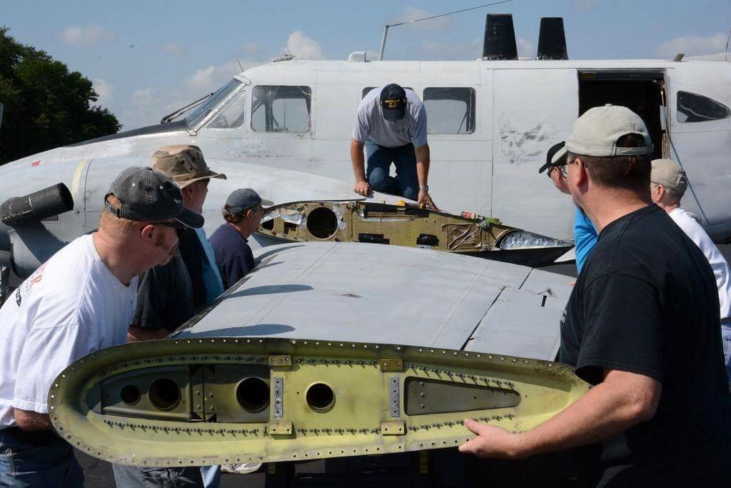 138th Aviation Company Memorial - July, 2016 Update 12 Reattaching the port outer wing panel. (Photo by Craig Landfield)