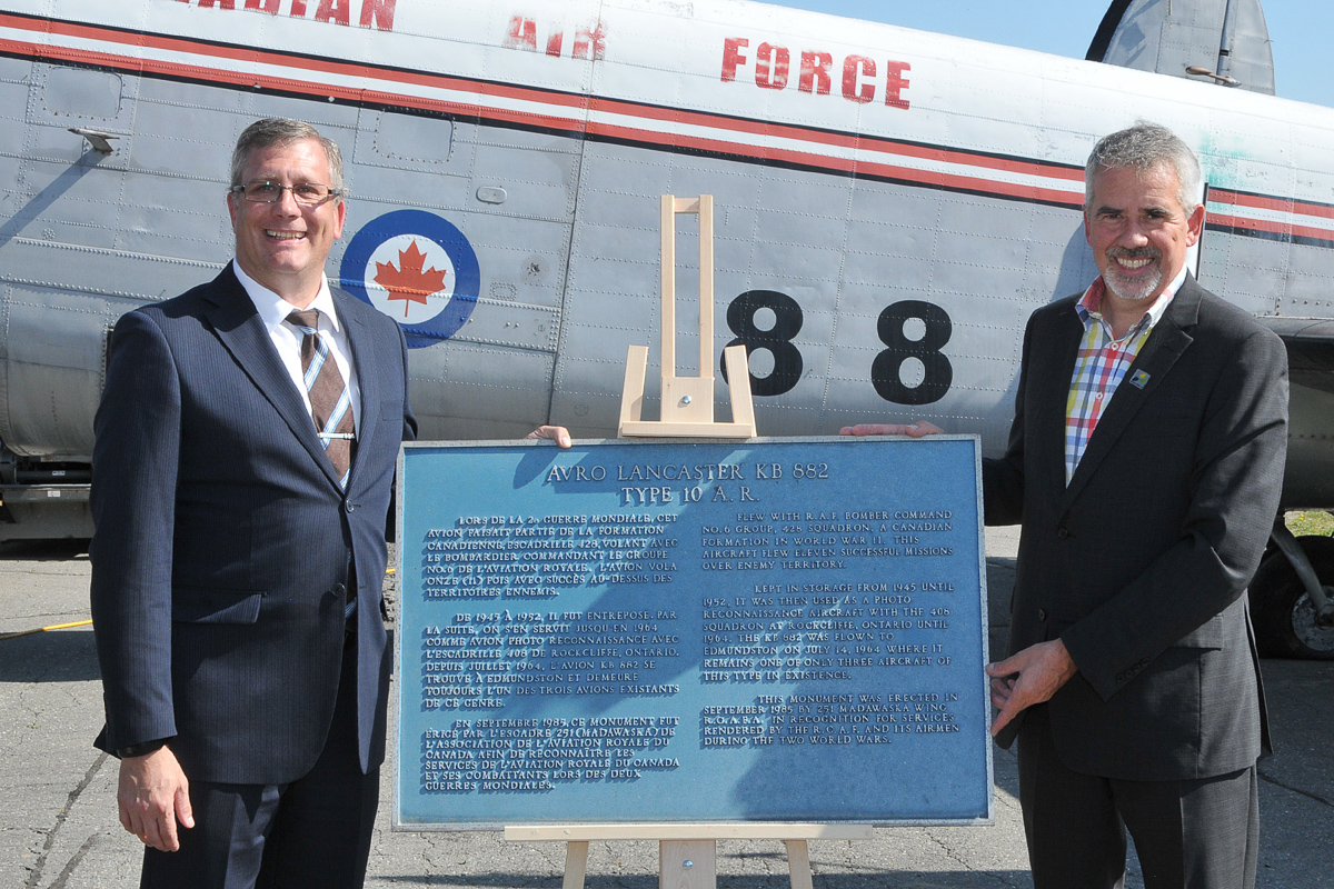 Lancaster KB882 Safely At Her New Home 14 Mayor Cyrille Simard (right) presents Kevin Windsor, curator of the National Air Force Museum of Canada, with the historic plaque that was affixed to a plinth in front of KB882. (Photo by Warrant Officer Fran Gaudet DND)