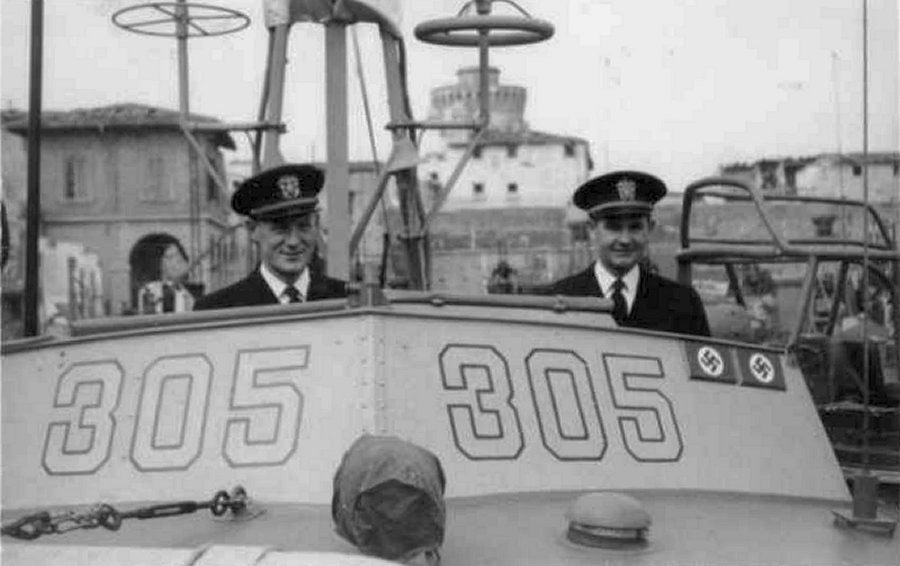 The National WWII Museum Launches Rides Aboard Restored, Operational Higgins Patrol-Torpedo Boat 13 Ensign Bleeker Morse (left) and Lieutenant Junior Grade Allan Purdy on the bridge of PT-305 in Leghorn (Livorno), Italy, on March 16, 1945. The “kill plaques” on the chart house signify the two enemy craft sunk by PT-305 to that date. Gift of Joseph Brannan.