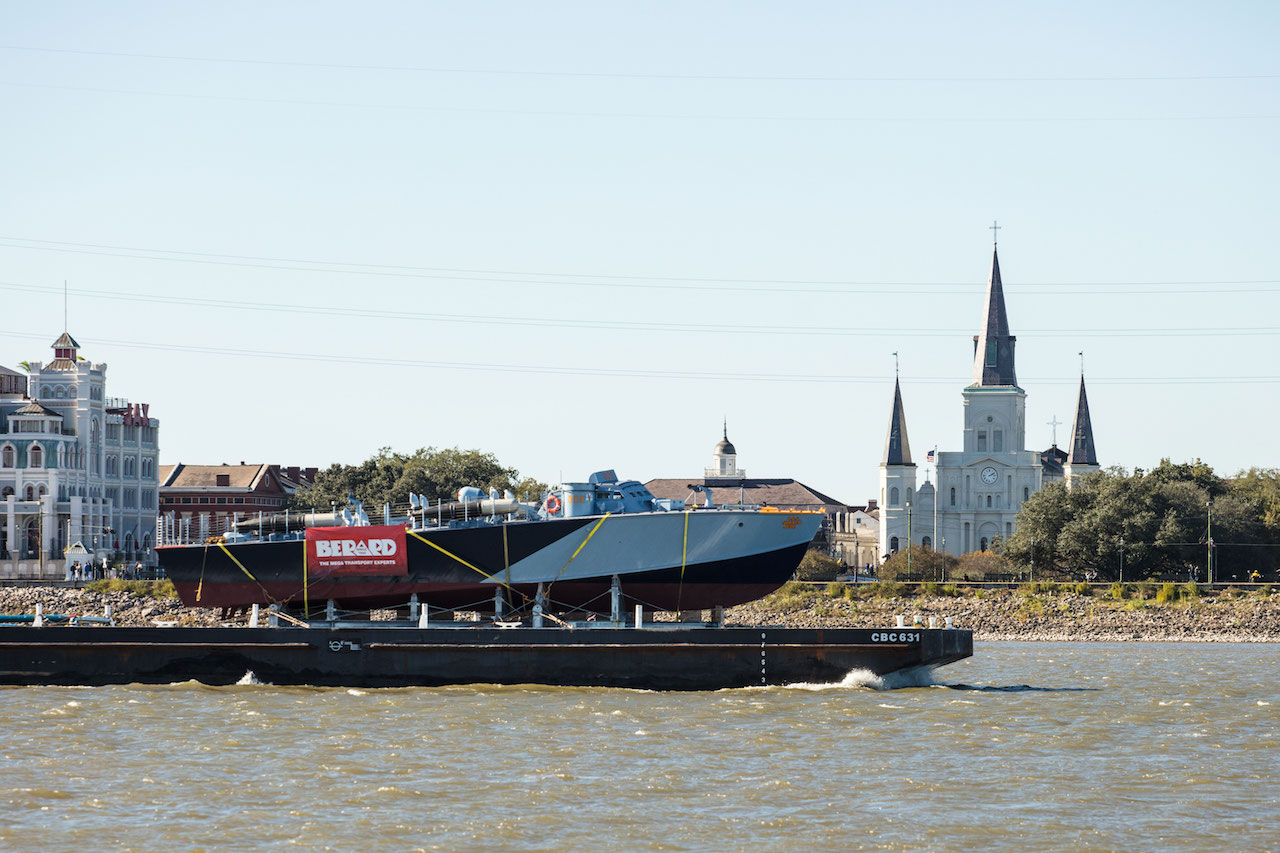 The National WWII Museum Launches Rides Aboard Restored, Operational Higgins Patrol-Torpedo Boat 14 PT-305 is transported by barge on the Mississippi River to begin sea trails at Seabrook Marine & Harbor.