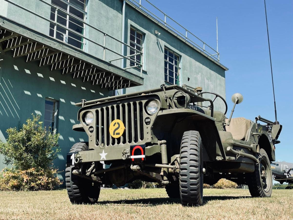 Military Aviation Museum - Tanks & Tracks Oct.1/2 - Last Call for Advance Tickets 14 A WWII U.S. Army jeep standing beside the RAF Goxhill control tower at the Military Aviation Museum in Pungo, Virginia.