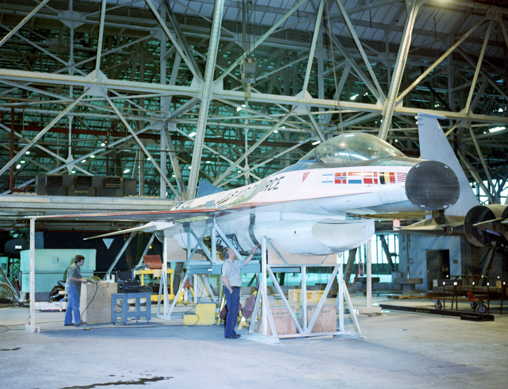 Fort Worth Aviation Museum to Unveil General Dynamics YF-16 Prototype #2 10 workmen inspect the fuselage of a yf 16 eagle aircraft upon its arrival at 20d824 1