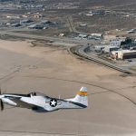Flight Test Files: North American P-51 Mustang - Learning to Trust Laminar Flow 11 The huge compass rose on Rogers Dry Lake formed a backdrop for a genuine National Advisory Committee for Aeronautics (NACA) P-51 Mustang owned and flown by William C. Allmon.