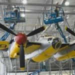 Transforming IWM Duxford: A New Era for Britain's Historic Airfield 11 A DeHavilland Mosquito being lifted to the roof of AirSpace at IWM Duxford © IWM