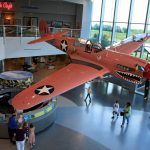 Visitors to the Air Zoo are treated to founder Sue Parish's P-40N (44-7619) painted in its lesser known camouflage color of Desert Pink. Despite the aircraft never seeing service in combat, it is known to millions of aviation enthusiasts. Photo via Airzoo.com