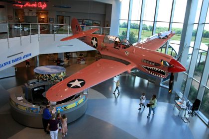 Visitors to the Air Zoo are treated to founder Sue Parish's P-40N (44-7619) painted in its lesser known camouflage color of Desert Pink. Despite the aircraft never seeing service in combat, it is known to millions of aviation enthusiasts. Photo via Airzoo.com