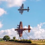 “On Freedom’s Wings” – Lancaster Bomber Sculpture Unveiled at Lincolnshire Gateway 14 BBMF Lancaster PA474 flies past the newly installed Bomber County Gateway Lancaster sculpture On Freedoms Wings on 11th September 2025. Photo Claire Hartley