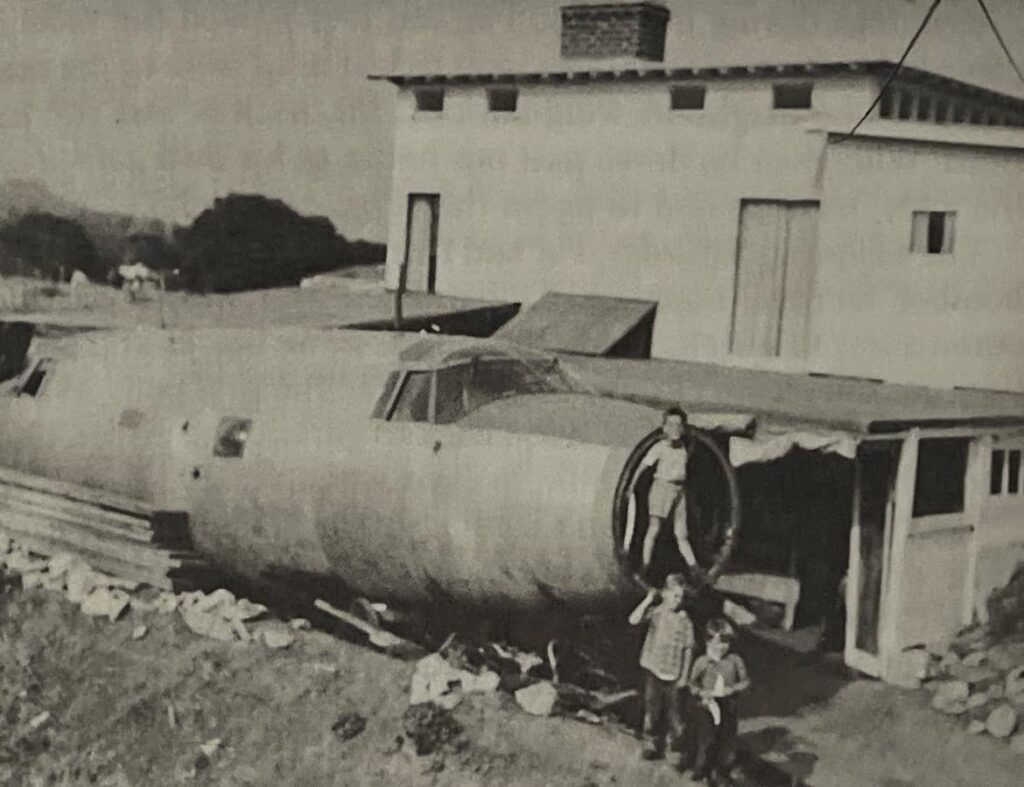 Charles Patterson’s children (Charles, David, and Sally) with the nose of the Marauder before neighborhood complaints forced Patterson to hide the bomber from public view (The Backyard Bomber of Pacific Palisades)