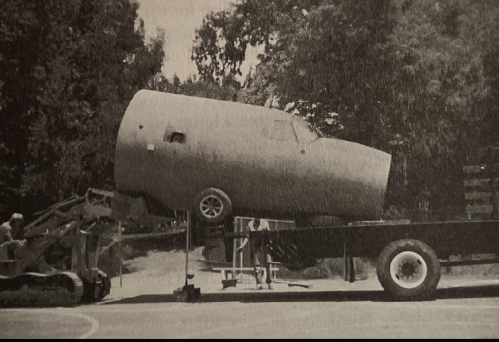 41-31856 is loaded onto the back of a flatbed truck bound for Chino Airport (The Backyard Bomber of Pacific Palisades)