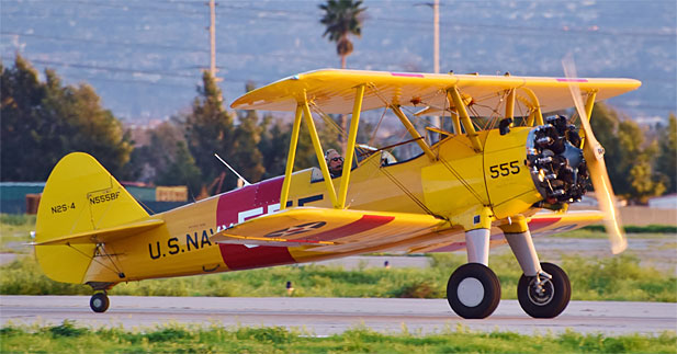 PT-17 Stearman 41-8746/N555BF arrives at Chino. [Photo via Planes of Fame]