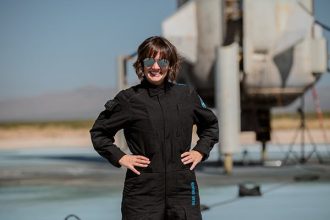 Sarah Knights posing at Blue Origin's New Shepard launch pad. Photo by Blue Origin.