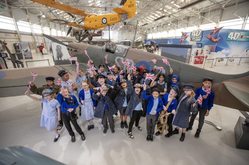 Students from Berrybrook Primary School celebrate the RAF Museum Midlands Lottery funding news announced on VE Day