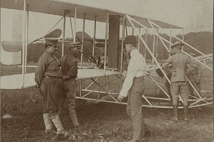 The Wright brothers and some Army Signal Corps soldiers work on the Wright Military Flyer as they test it out at Fort Myer Virginia 1909.
