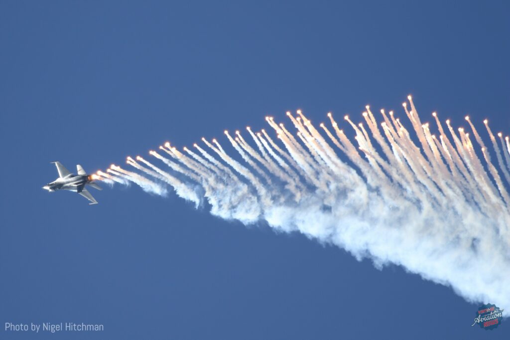 Flares are fired off by Capt. Ethan Smith USAF as his F-16 climbs into the Wanaka sky. [Photo by Nigel Hitchman]